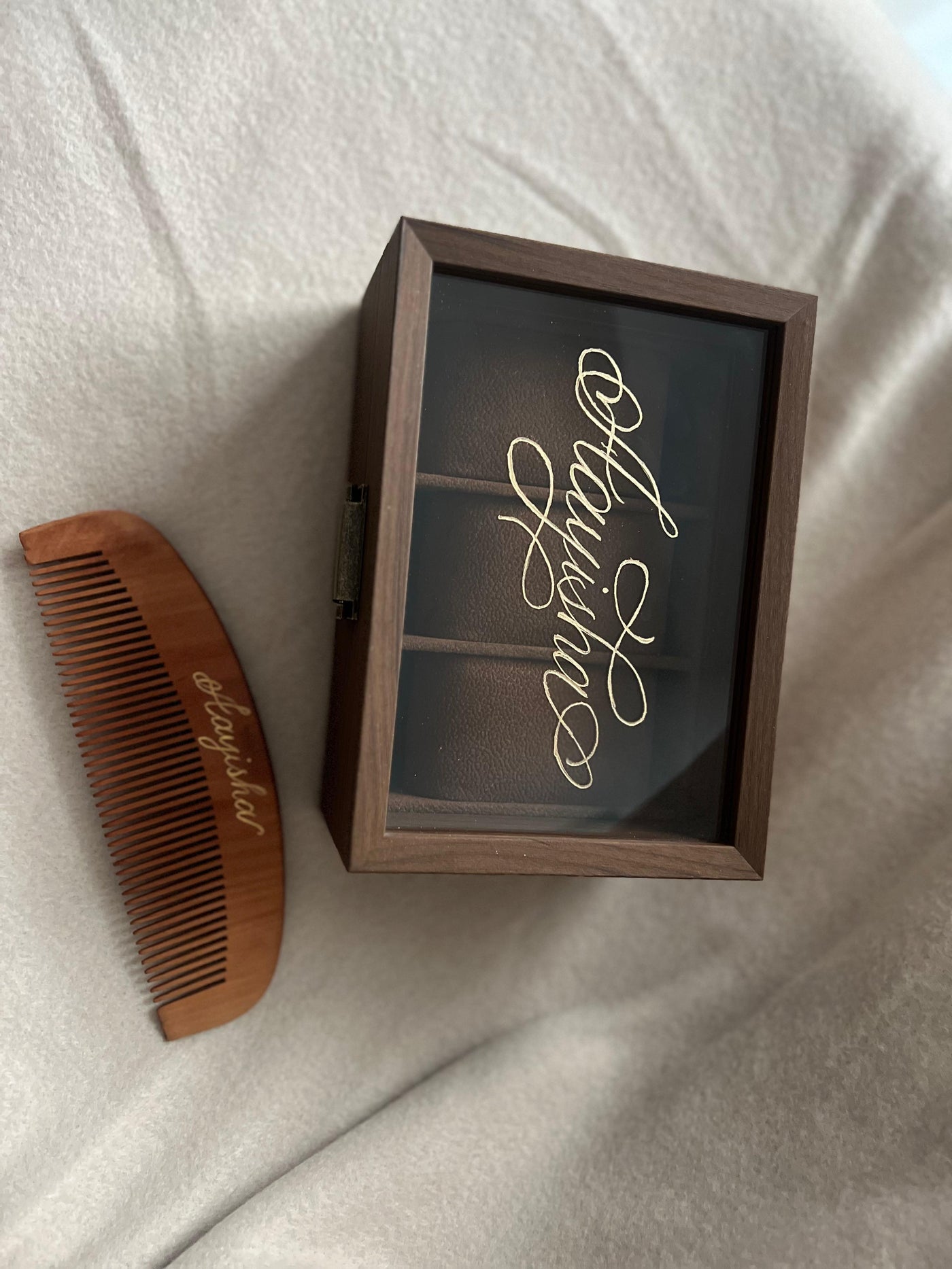 Personalised name engraving on a wooden jewellery box and comb