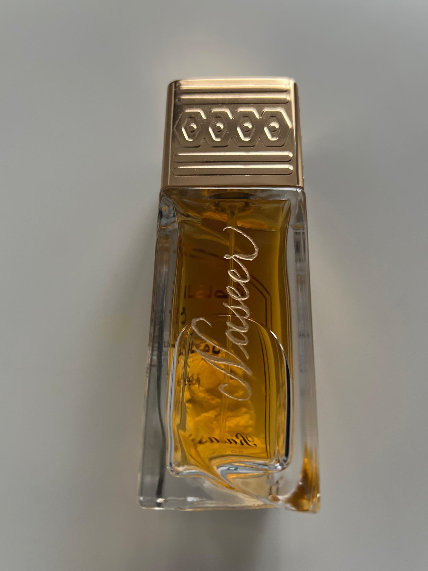 Personalised name engraving on a glass perfume bottle