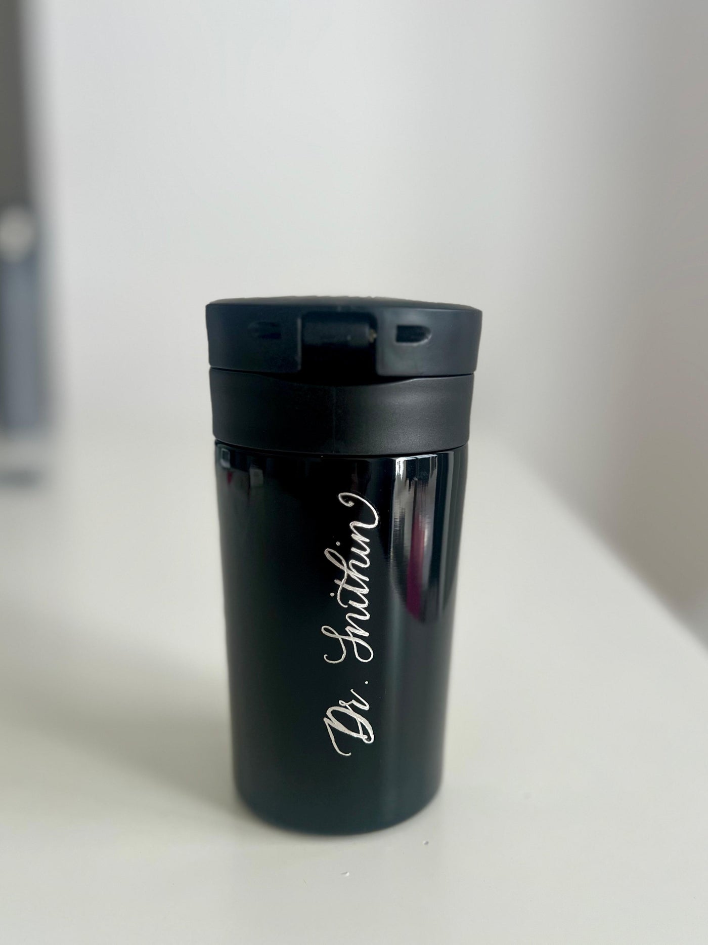 Personalised name engraving on a travel cup